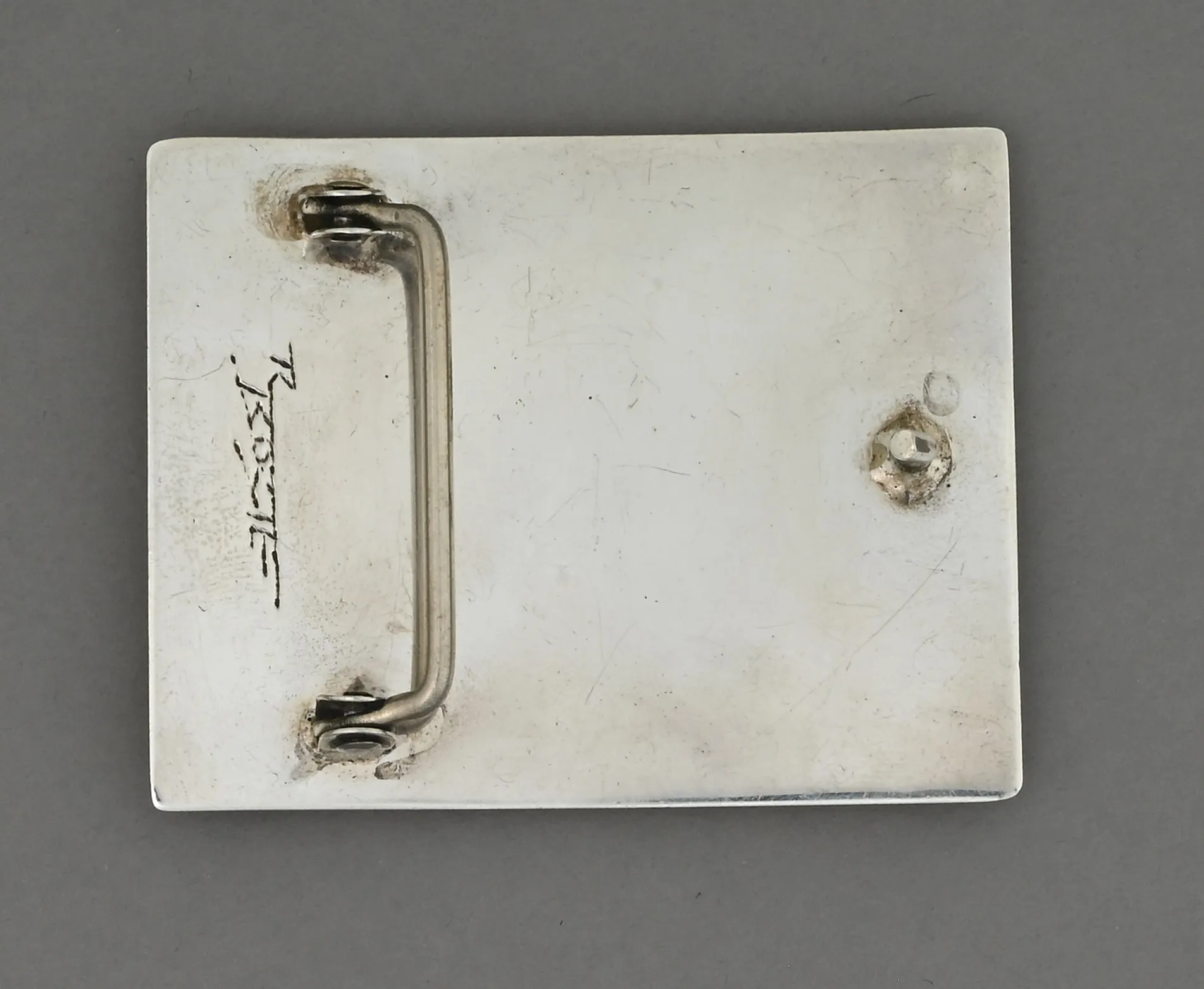 Belt Buckle with Inlay (Tufa Cast) by Richard Tsosie