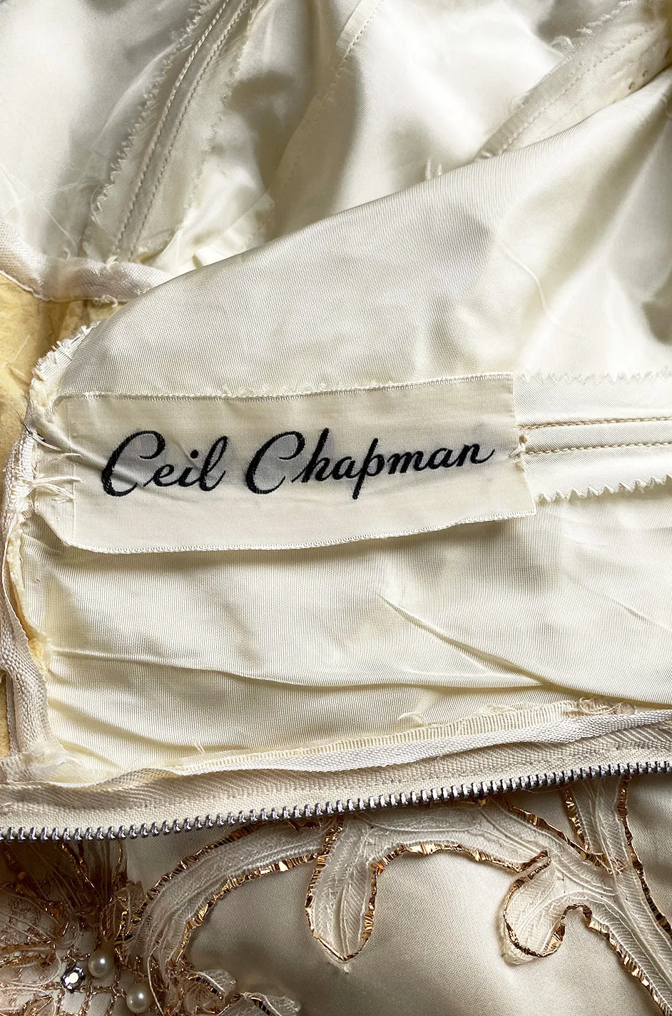 Incredible 1950s Ceil Chapman Ivory Silk Satin Dress w Gold Metal Ribbon Detailing