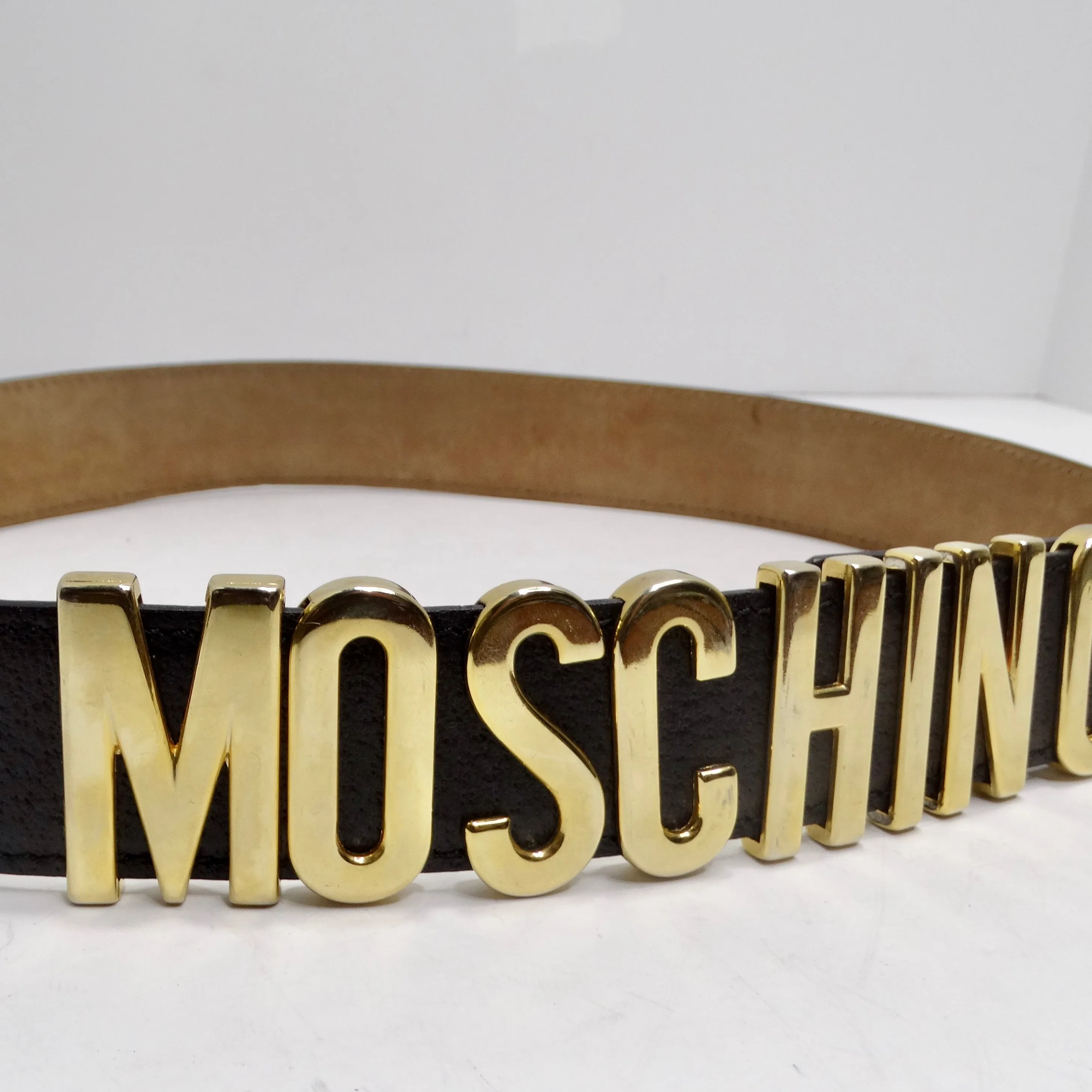 Moschino 1990s Gold Tone Logo Black Leather Belt